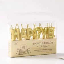 Pack of gold 'HAPPY' letter candles for birthday cake (packaged).