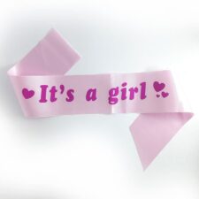 Pink 'It's a girl!' baby shower ribbon sash