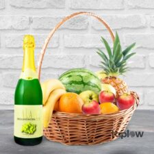 Fruit basket with sparkling drink bottle, watermelon and pineapple â€” gift hamper.