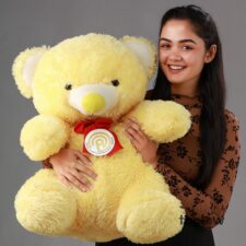 Red velvet style cake with cream cheese frosting and sprinkles