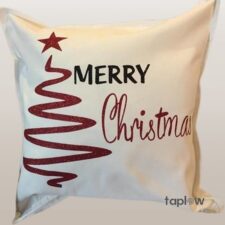 White cushion with â€œMerry Christmasâ€ and stylized tree graphic