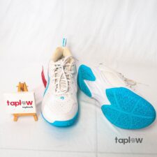 White training shoes with blue outsole photographed on white background (pair).