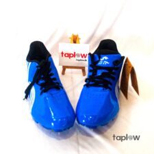 Pair of glossy blue sports shoes displayed on white background (product shot).