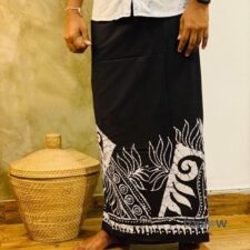 Black sarong with white traditional border motif on model