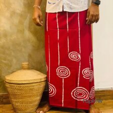 Black sarong with red spiral motif shown on model