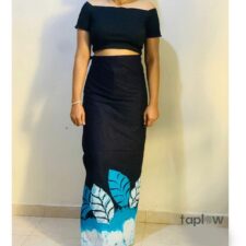 Woman wearing black crop-top and blue printed sarong
