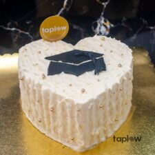 Giant blue teddy bear held by model