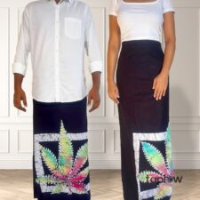 Black sarongs with colorful patterned hem and white shirts