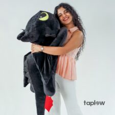 Chocolate cake with chocolate shavings, frosting, and cherries on top