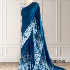 Blue printed saree draped on mannequin with patterned pallu