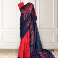 Black saree with red floral motif and contrast inner fabric â€” product image.