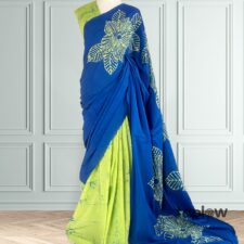 Royal blue saree with lime-green inner drape on mannequin