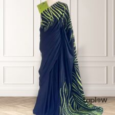 Navy saree with lime-green abstract stripes on mannequin â€” product image.