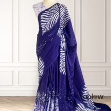 Deep purple saree with white fern-style print on mannequin